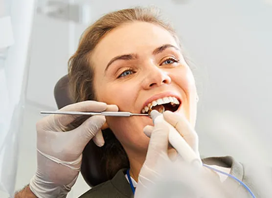 Patient in dental chair undergoing dental exam
